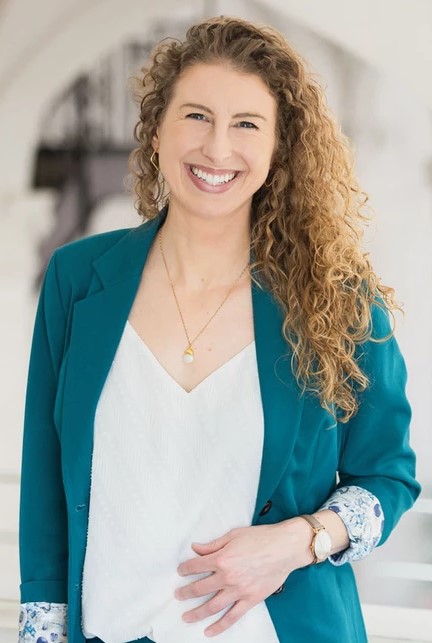 Leah Stiegler, Principal and Management-side Employment Lawyer at Woods Rogers seen posing for a photo with a bright smile on her face